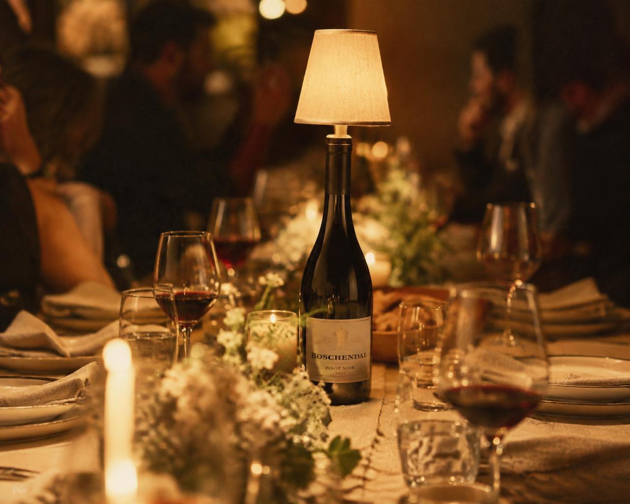 Dining table: Red wine bottle as a table light